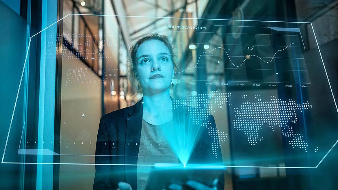a person looking at a holographic data visualization.