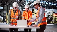 GXO Logistics employees in an industrial setting