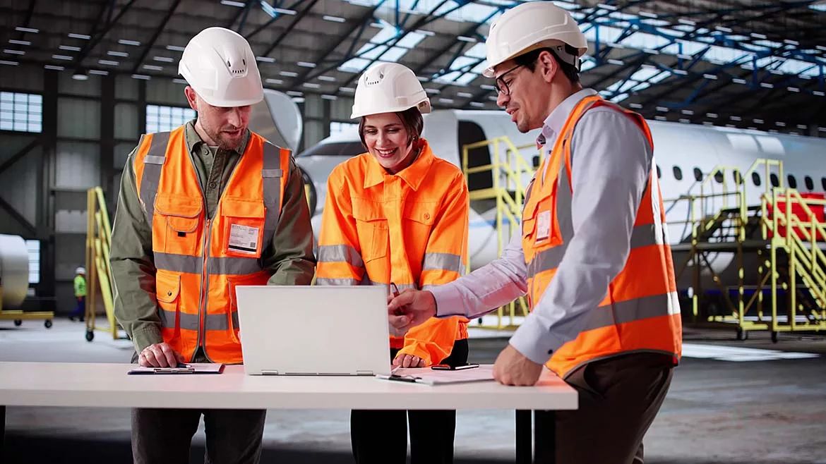 GXO Logistics employees in an industrial setting