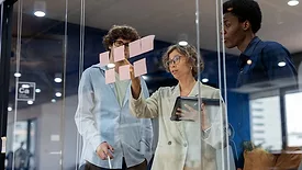 two people working together in an office environment