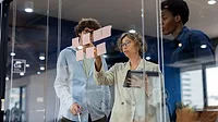 two people working together in an office environment