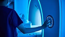 a patient within a Magnetic Resonance Imaging (MRI) machine. 