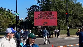 a motivational billboard from Nike, placed along the route of the Chicago Marathon, with a message tailored to the distance remaining