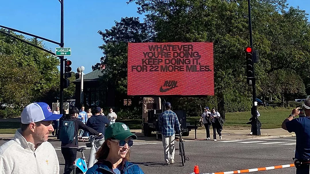 a motivational billboard from Nike, placed along the route of the Chicago Marathon, with a message tailored to the distance remaining