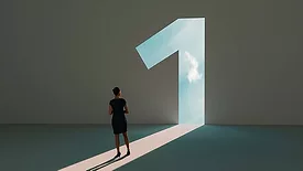 The image is a stock photo that represents the concept of reaching first place, leadership, or a new beginning