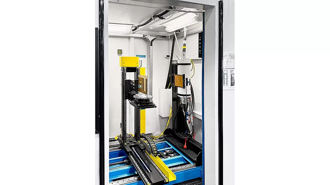 an industrial X-ray or CT scanning system designed for automated inspection and assembly.