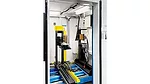 an industrial X-ray or CT scanning system designed for automated inspection and assembly.