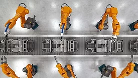 an automated car manufacturing assembly line utilizing industrial robotic arms