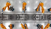 an automated car manufacturing assembly line utilizing industrial robotic arms