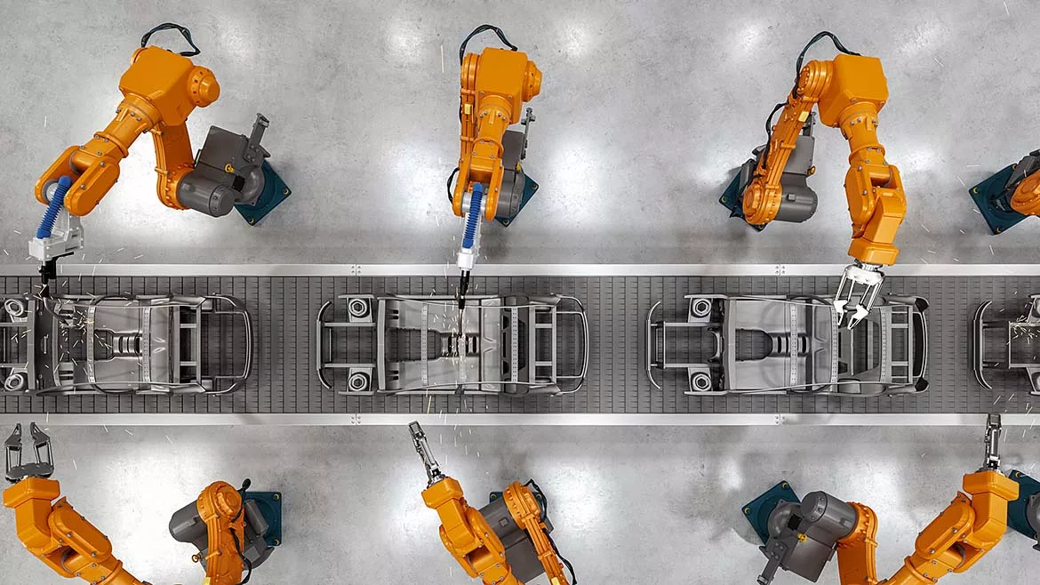 an automated car manufacturing assembly line utilizing industrial robotic arms