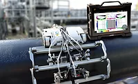 This image displays a Eddyfi Technologies Cypher portable inspection instrument alongside a scanner for non-destructive testing (NDT). 