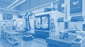 This image depicts a modern industrial manufacturing facility utilizing robotic automation and CNC machinery.
