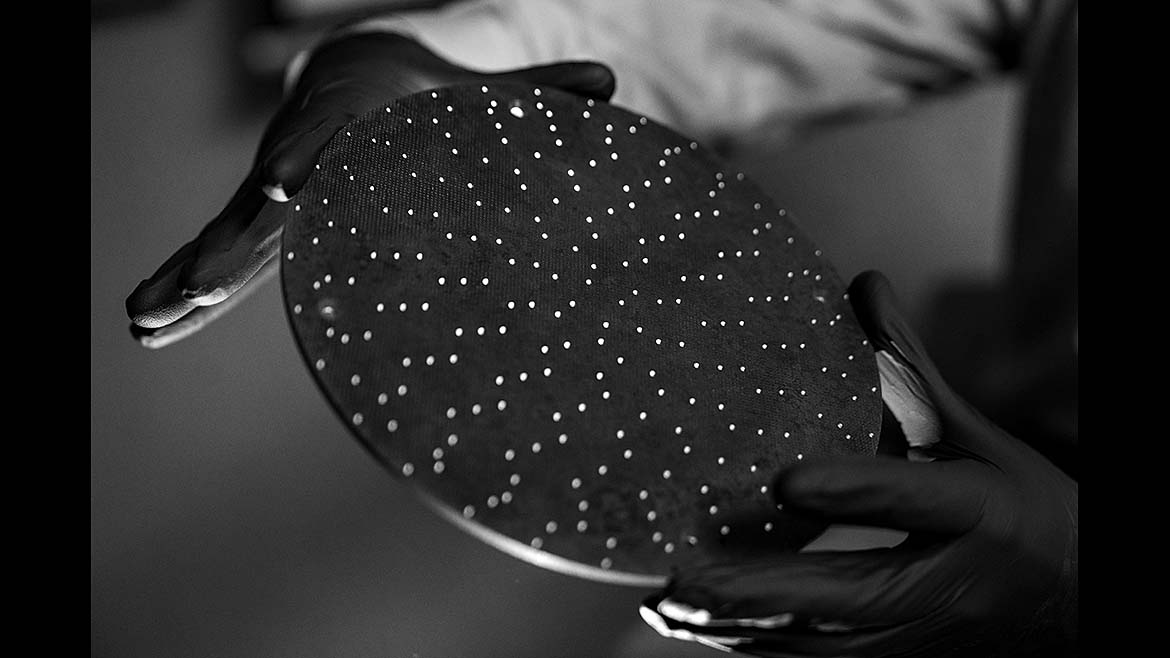 The item shown is light-transmitting concrete, a composite material embedded with optical fibers to allow light to pass through. 