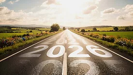 This image depicts a conceptual representation of the road leading into the year 2026, often symbolizing a hopeful future and new beginnings. 