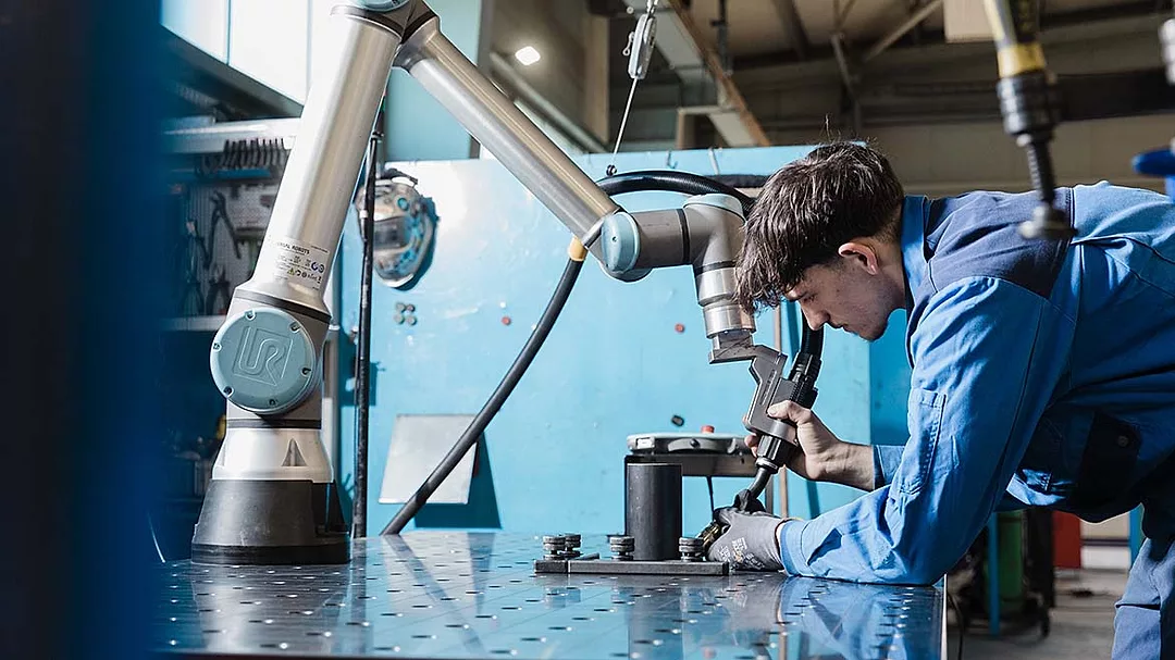 The item pictured is a Universal Robots e-Series collaborative robot