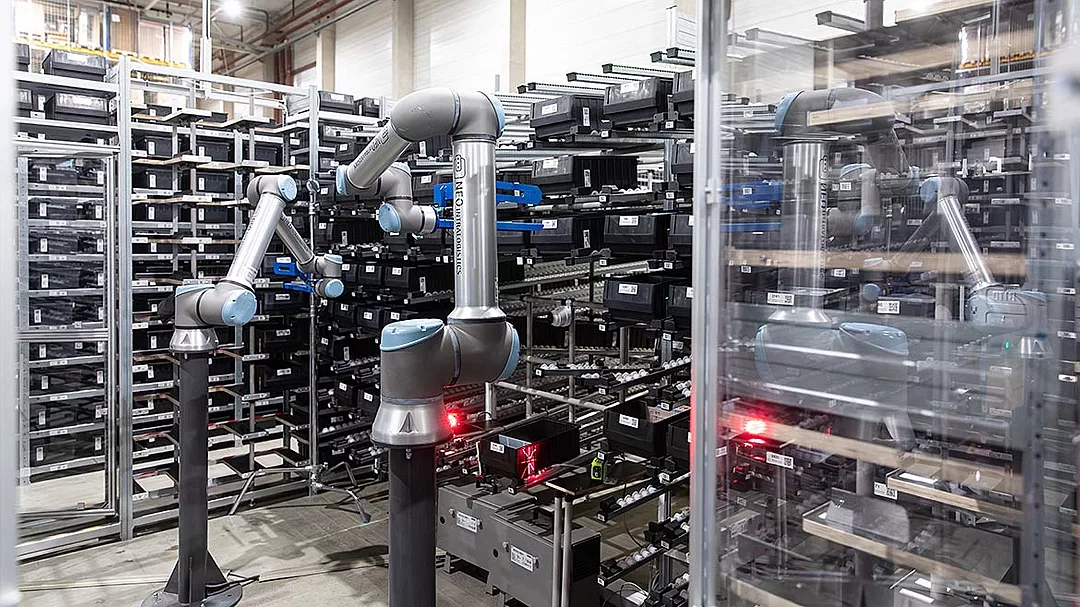 The image features a NEOintralogistics robotic picking system designed for warehouse automation. 
