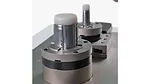 The item shown is a precision workholding clamping device, such as a chuck or collet system, used to secure workpieces in machinery like CNC milling machines. 