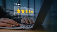This image represents the concept of online customer feedback and reputation management, featuring a digital overlay of a five-star rating. 
