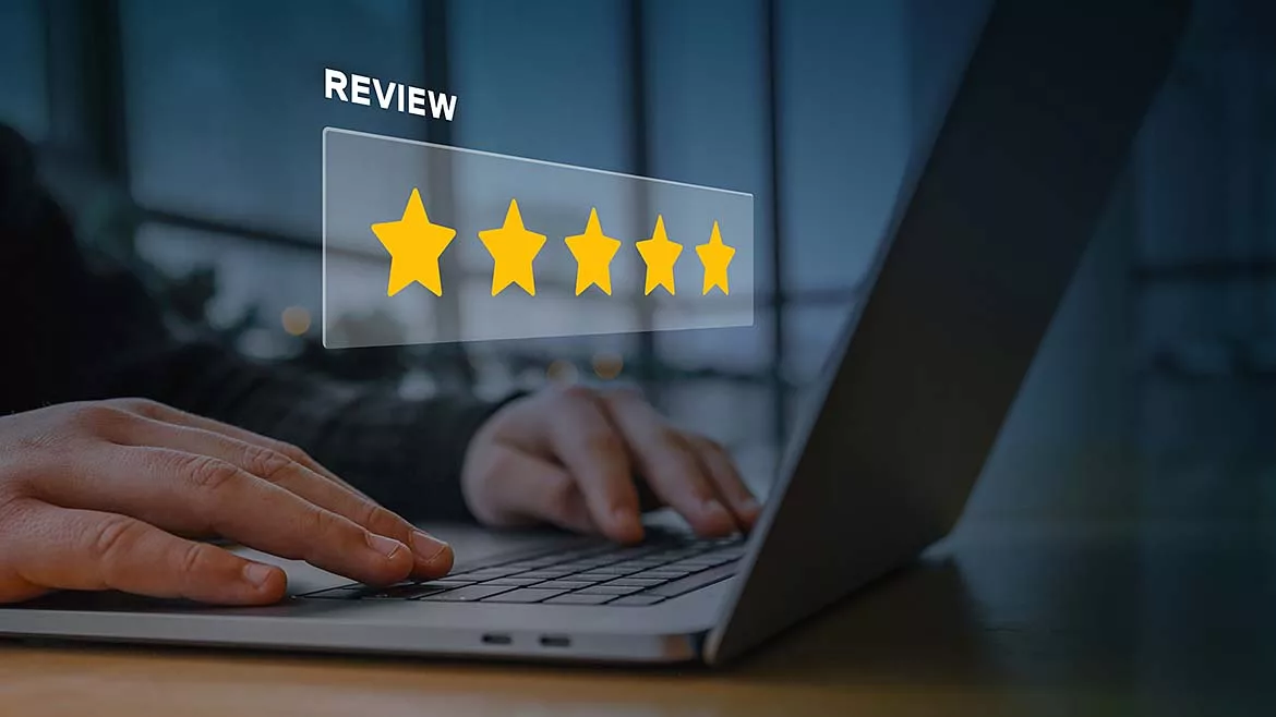 This image represents the concept of online customer feedback and reputation management, featuring a digital overlay of a five-star rating. 