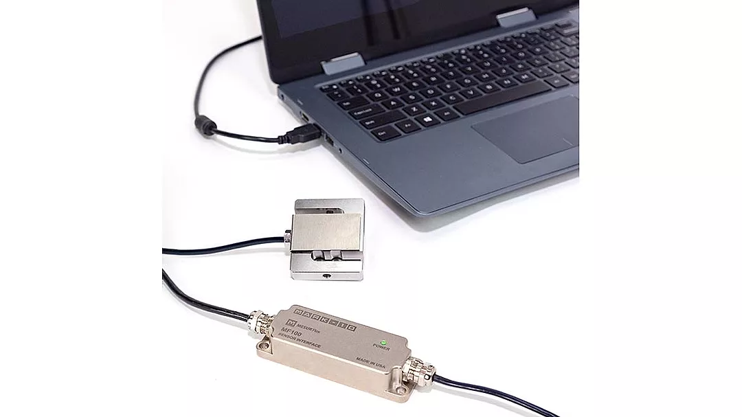 A load cell is connected to a PC via a single integrated interface