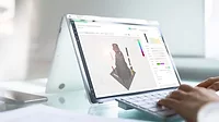 The image features a Microsoft Surface Book running software to enhance data-driven processes for additive manufacturing (AM). The image features a Microsoft Surface Book running software to enhance data-driven processes for additive manufacturing (AM).