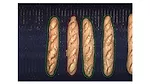 The image shows baguette bread, a long, thin loaf of French origin typically made from lean dough. 