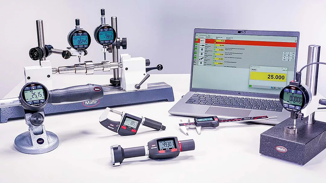 This image displays a collection of Mahr handheld and stationary precision measuring instruments used for industrial metrology.