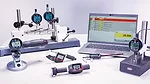 This image displays a collection of Mahr handheld and stationary precision measuring instruments used for industrial metrology. 