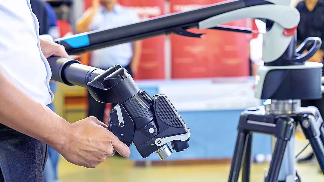 This item is a portable measuring arm, specifically a Hexagon Absolute Arm. 
