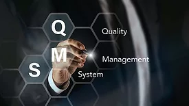 This image illustrates the concept of a Quality Management System (QMS)