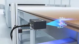 The item shown is a Baumer OX series smart 2D profile sensor 