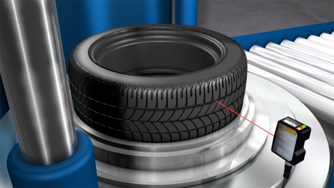 The image displays a tire inspection system used in automotive manufacturing to ensure quality and safety. 
