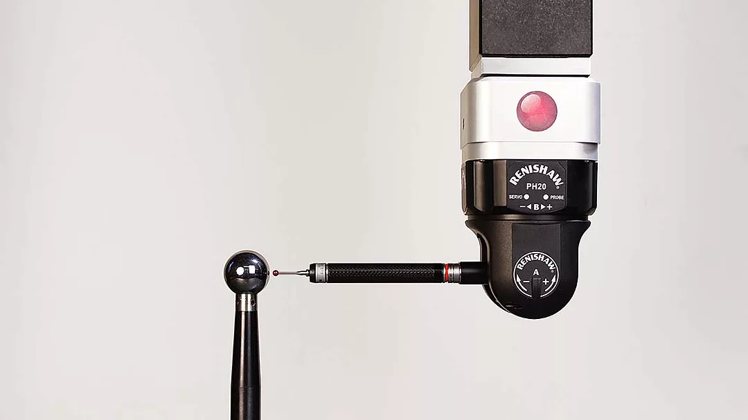 a Renishaw PH20 5-axis touch-trigger probe head used on a Coordinate Measuring Machine (CMM). 