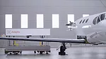 The image displays an Adaptix NDT3D inspection tool being used on an aircraft wing. 