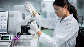 This image depicts a scientific laboratory setting, likely for medical research or diagnostic testing.