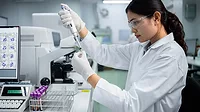 This image depicts a scientific laboratory setting, likely for medical research or diagnostic testing. This image depicts a scientific laboratory setting, likely for medical research or diagnostic testing.