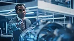 a professional in a modern laboratory setting, possibly working in aerospace or high-tech engineering