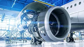 a high-bypass turbofan jet engine undergoing maintenance or inspection