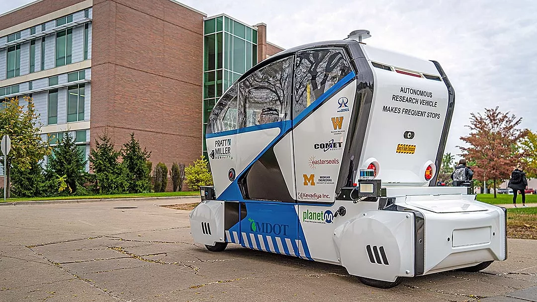 This image shows an autonomous shuttle bus developed for wheelchair accessibility at Western Michigan University.