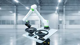 This is a FANUC CRX collaborative robot featuring a lightweight white design with bright green accents.