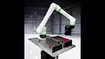 This is a FANUC CRX collaborative robot featuring a white arm with green accents performing industrial automation tasks