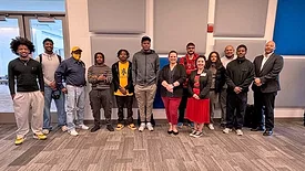 a group of individuals standing together indoors