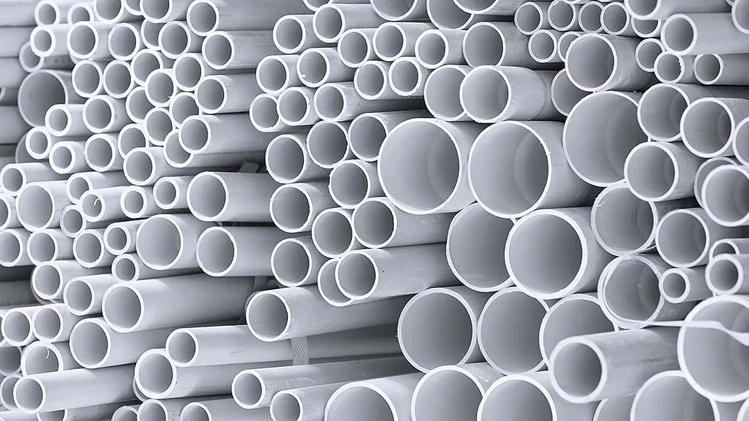 stacked white plastic pipes
