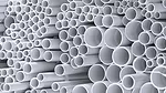 stacked white plastic pipes