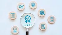 various icons on wooden discs representing quality assurance and ISO standards various icons on wooden discs representing quality assurance and ISO standards