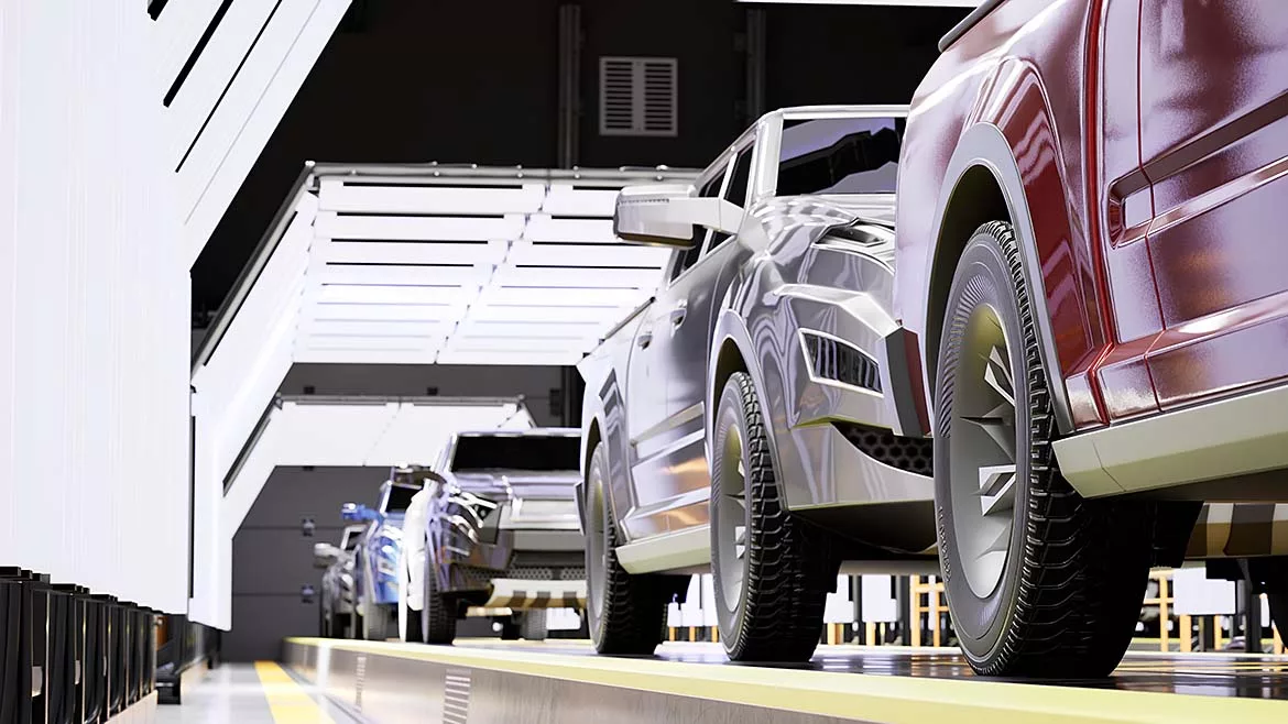 This image depicts a modern automotive manufacturing assembly line, likely focusing on quality control inspections for new pickup trucks