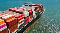 a massive container ship loaded with cargo containers traversing open water. a massive container ship loaded with cargo containers traversing open water.