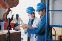 management men working factory floor