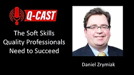 Daniel Zrymiak with Q-cast logo