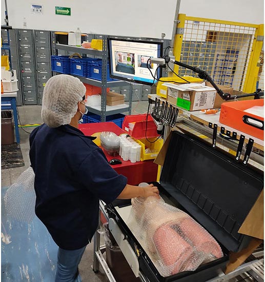 employee assembling medical training dummies